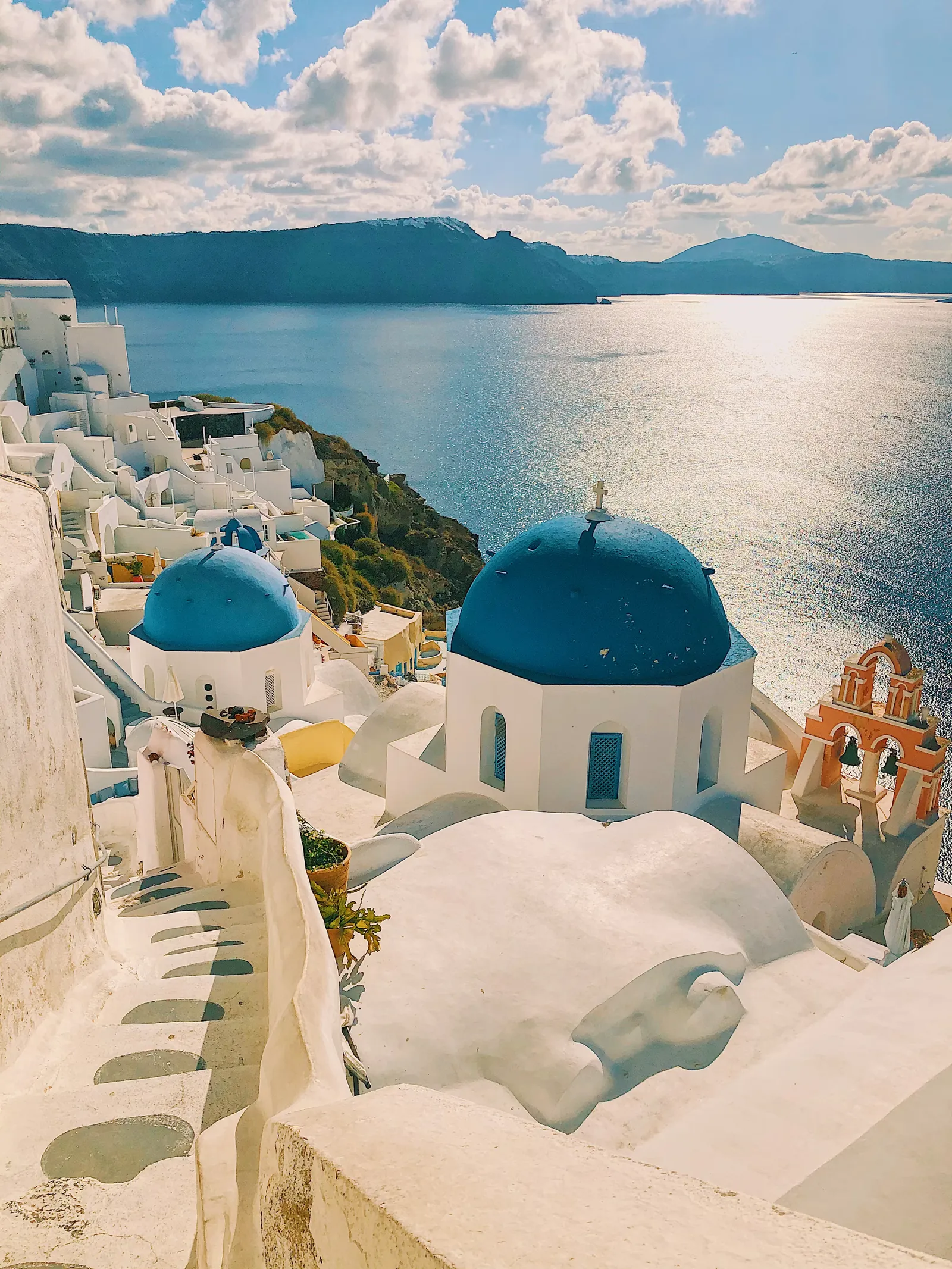 Blue-domed churches of Santorini above the Aegean Sea